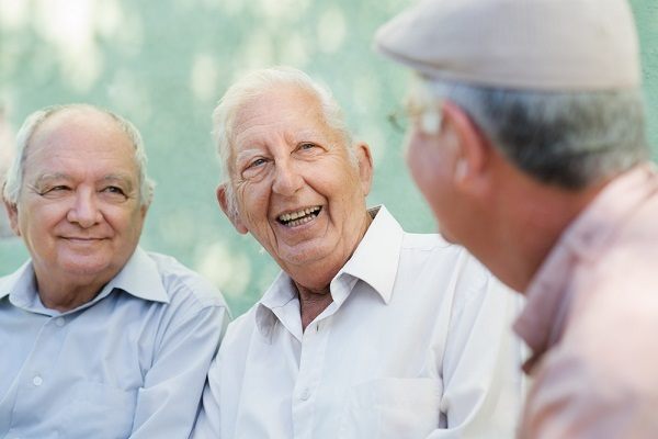 Group of happy elderly men laughing and talking Group of happy elderly men laughing and talking
